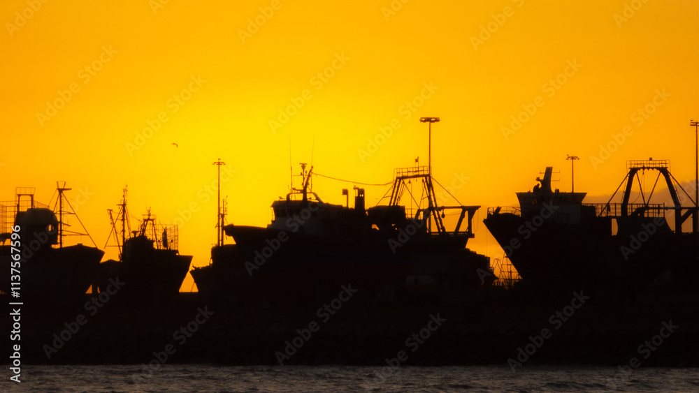 Fototapeta premium sunset over the port of the city of Essaouira, in Morocco