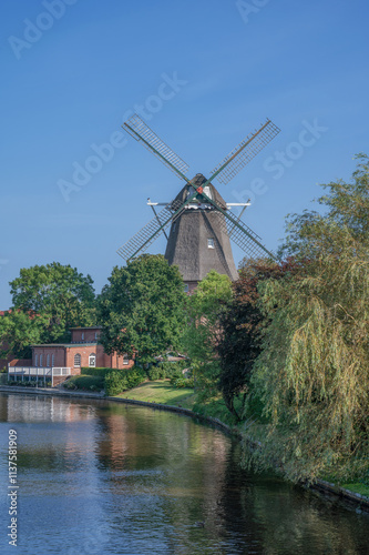 Windmill at Knockster Tief in Hinte,Aurich District,East Frisia,lower Saxony,Germany photo