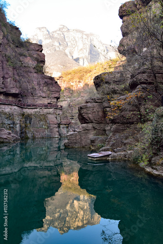 Mountain Reflection in the River Canyon at Yuntai Mountain in China photo