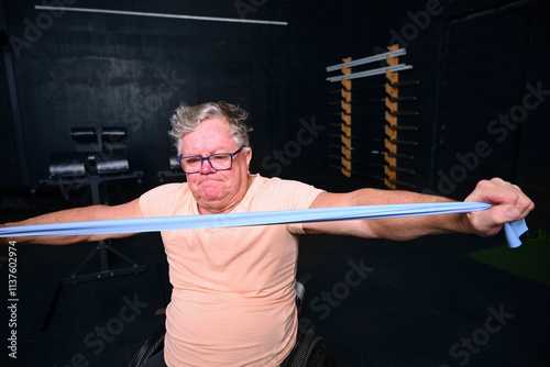 Disabled man exercising in gym photo