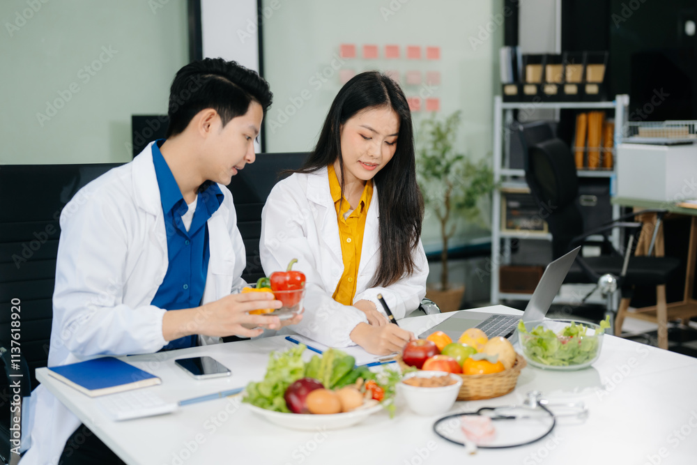 Nutritionists consulting on healthy food choices, meal planning, and wellness concepts Nutritionists consulting on healthy food choices, meal planning, and wellness concepts