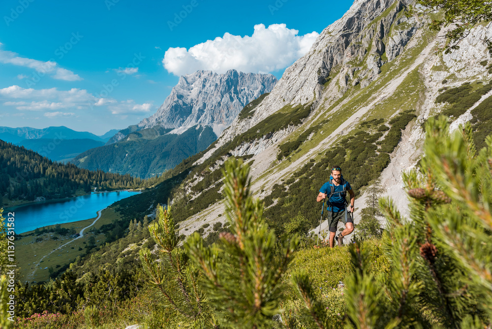 Austria, Tyrol, Young man hiking in the maountains at Lake Seebensee Austria, Tyrol, Young man hiking in the maountains at Lake Seebensee