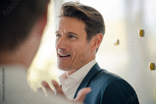 Mature businessman sharing his knowledge with younger colleague