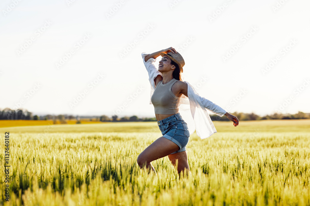 Beautiful woman with hat walking at field
