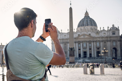 Man capturing photos of Fontana dei Quattro Fiumi on sunny day photo