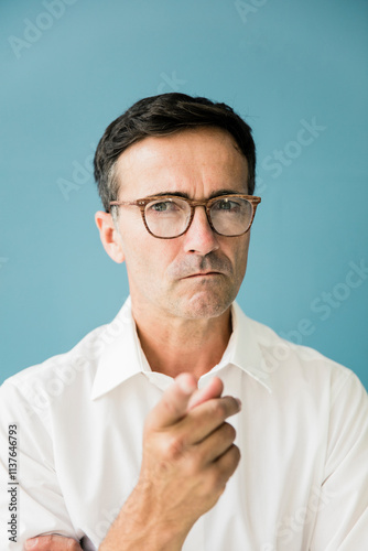 Portrait of angry businessman pointing his finger photo