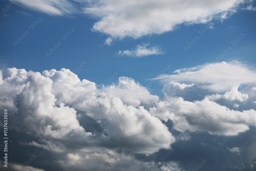 Vibrant Blue Sky with Fluffy White Clouds on a Clear Day Vibrant Blue Sky with Fluffy White Clouds on a Clear Day