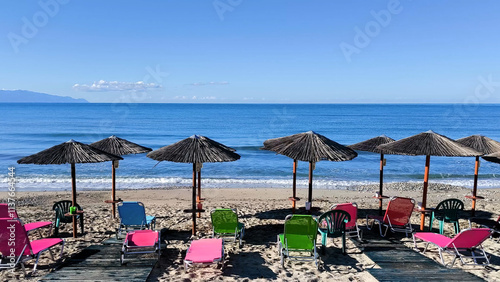 beach with umbrellas and chairs