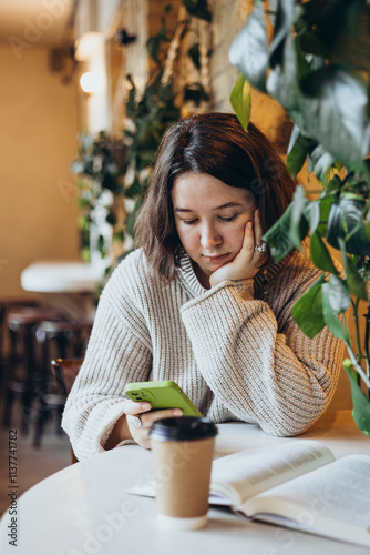 Young woman reading a book in a cozy bookstore setting