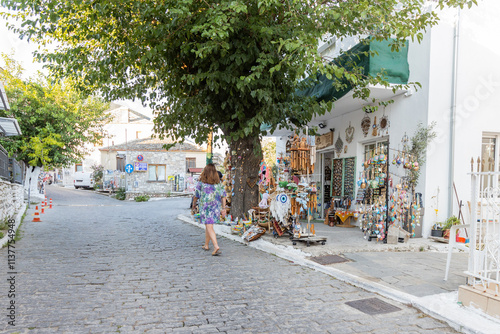 Fototapeta Naklejka Na Ścianę i Meble -  Exploring Greek Village Local Shop Filled With Souvenirs and Local Crafts on a Sunny Day