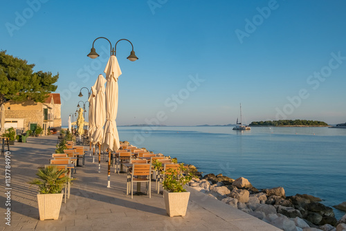 Fototapeta Naklejka Na Ścianę i Meble -  Picturesque view of the charming Primosten town and the Adriatic Sea in Croatia.