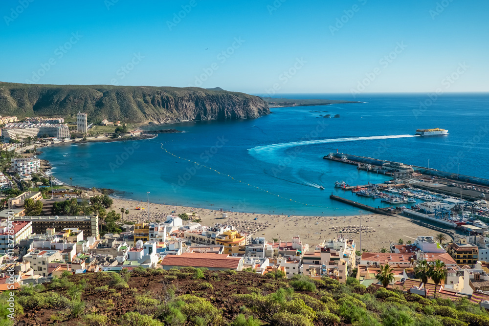 Aerial view of Playa de las Americas beach at sunset, Tenerife, Spain.