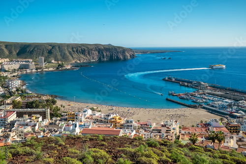 Obraz na płótnie Aerial view of Playa de las Americas beach at sunset, Tenerife, Spain. w salonie