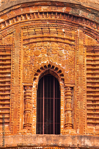 Artistic terracotta carvings embellishing the shikhara (spire) of Ram Chandraji's Temple, Guptipara, West Bengal, India. photo