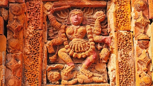 Depiction of Hindu Goddess Kali in a terracotta carving on Sri Raghunath Temple, Ghurisha , Birbhum, West Bengal, India. photo