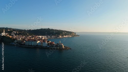 Wallpaper Mural Piran in the evening from above, Slovenija / Slovenia, flying the drone around the coastal city by mediterranean sea with lighthouse and church on the cliff in the sunset. Torontodigital.ca