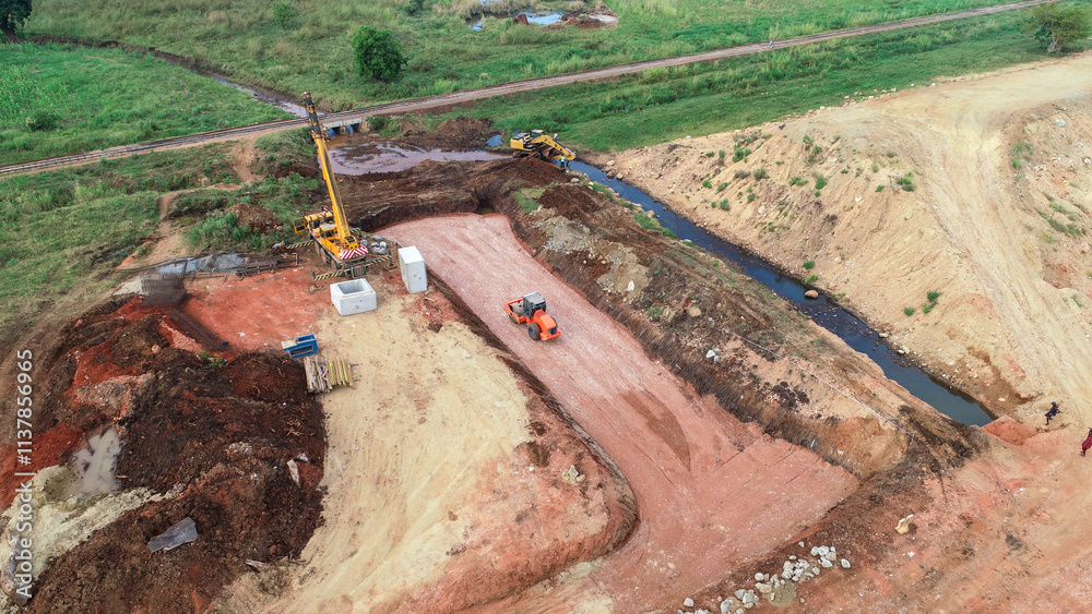 Obraz premium Aerial View of Heavy Machinery in Action on Construction Site