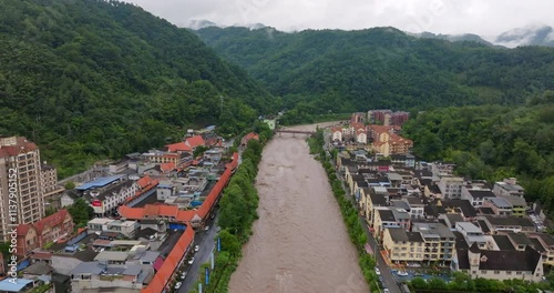 Aerial view of a flooding river in mddle of the Huashuiwan town, in Sichuan, China photo