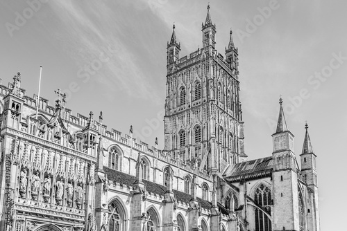 The gothic Gloucester Cathedral, the Cathedral Church of St Peter and the Holy and Indivisible Trinity, St Peter's Abbey in Gloucester, Gloucestershire, England, UK in black and white photo