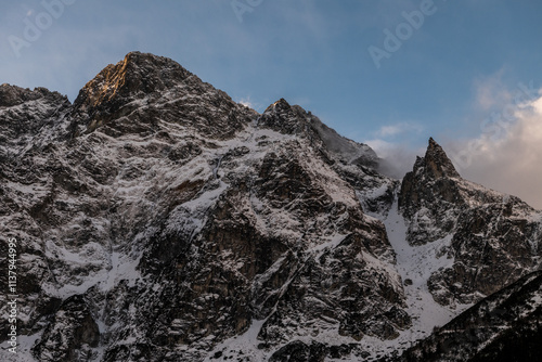 Fototapeta Naklejka Na Ścianę i Meble -  Mountains peaks of Tatra range in Poland at winter sunrise.