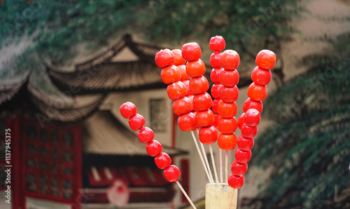 traditional Chinese candied hawthorn skewers, known as Bing Tang Hu Lu. A beloved winter snack and a nostalgic symbol of Chinese street food culture, especially during the New Year festivities.