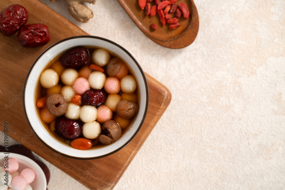 Red and white tangyuan with syrup soup, dried longan pulp, red dates for Winter solstice. Red and white tangyuan with syrup soup, dried longan pulp, red dates for Winter solstice.