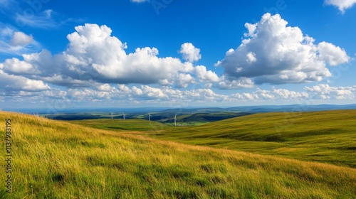 A serene landscape showcasing a wind farm on picturesque rolling hills under a bright blue sky with fluffy white clouds, symbolizing renewable energy and sustainable living.