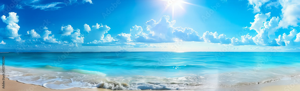 Obraz premium A beautiful beach with clear blue water, white clouds, and bright sun shining on the calm ocean. Perfect for summer vacation and travel poster designs.
