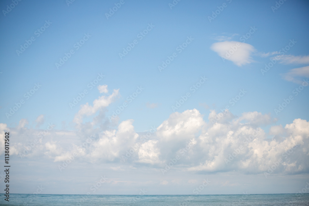 Sky background with clouds. White clouds against a blue sky. Sky background with clouds. White clouds against a blue sky.