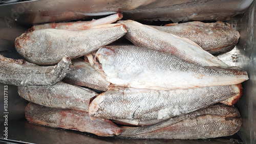 Frozen hake fish in a market fridge