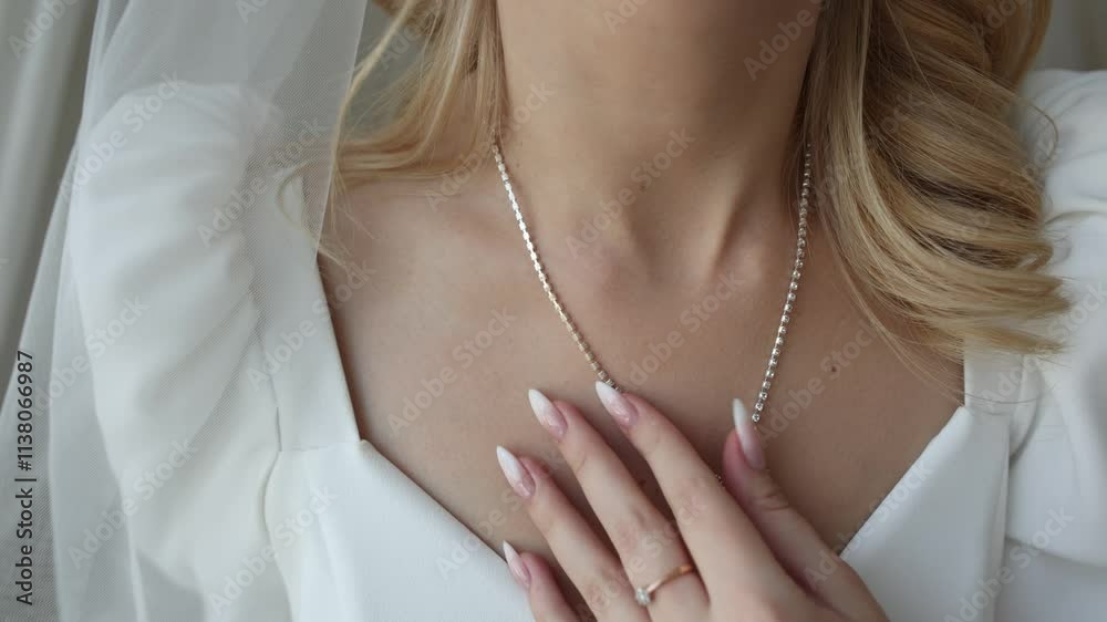 a necklace on the neck of the bride at the wedding a necklace on the neck of the bride at the wedding
