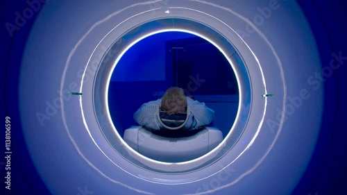 CT Scanner. Patient receiving a computed tomography brain scan.