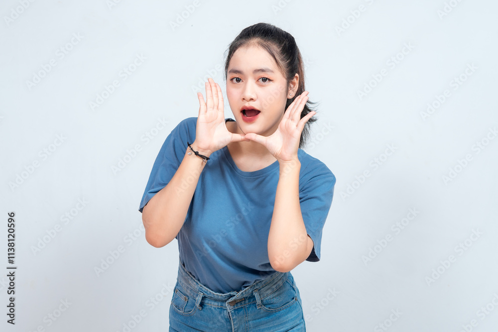 Surprised Asian woman reclines on her hands and shouting while looking at the camera over white background Surprised Asian woman reclines on her hands and shouting while looking at the camera over white background