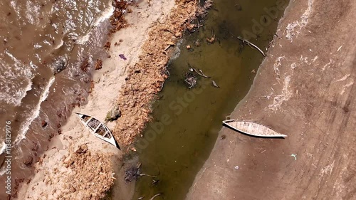 Vertical view Wrecked pirogues on the shores of Turkana Lake in Kenya photo