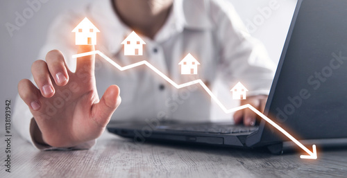 Arrow with houses. Housing market crash or decline