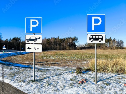 Close-up: road signs parking electric car. Road sign parking on a sunny winter day.