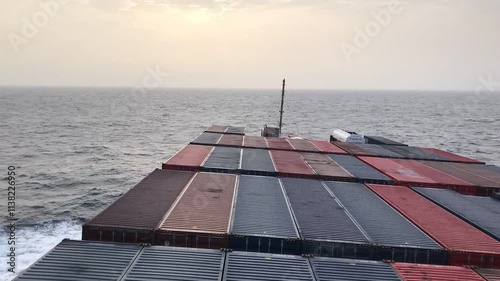 View from the bridge wings of a container ship at sea in the morning