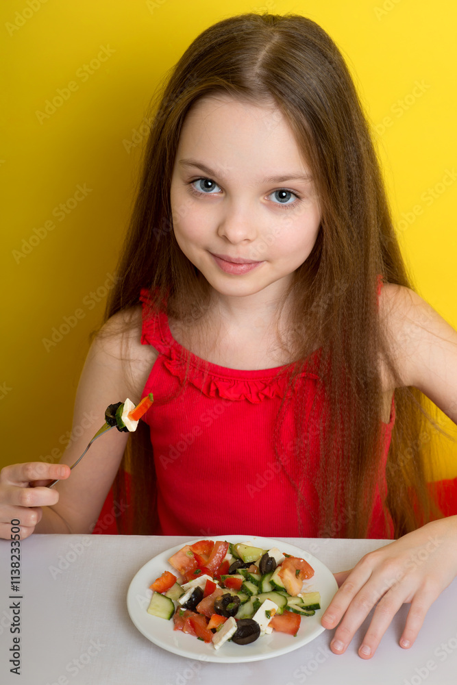 Cute little child with the vegetables salad. Kid and Healthy Eating. Little girl and healthy food concept. Cute little child with the vegetables salad. Kid and Healthy Eating. Little girl and healthy food concept.