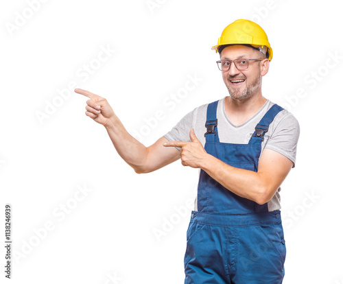 Promoter construction worker pointing to blank space - copy space. One repairman with happy laugh teaching, half length body, isolated on white background. Craftsman against white wall photo