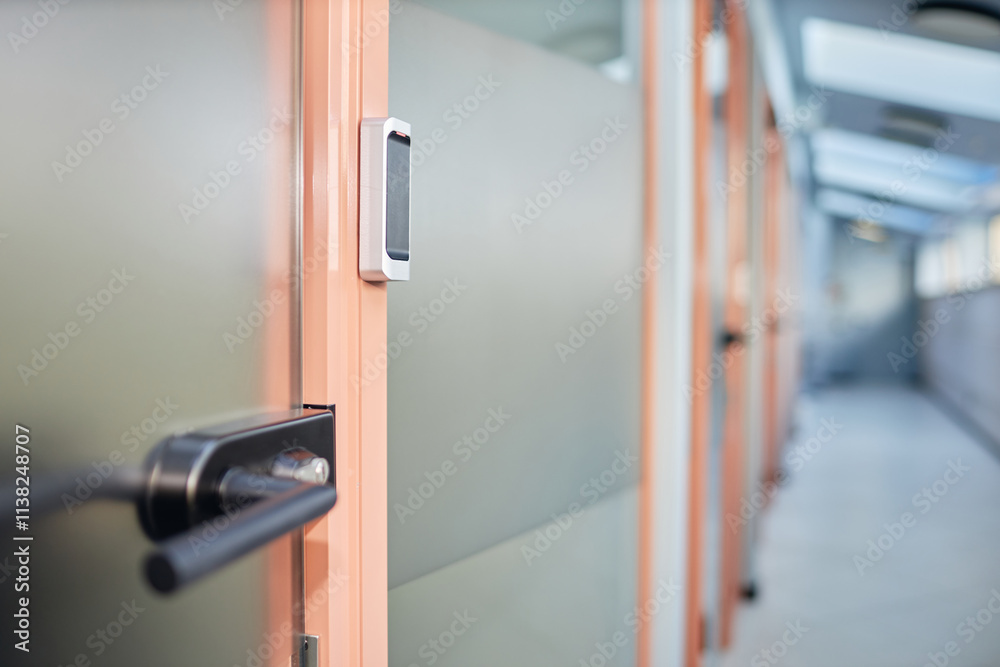 Background shot of NFC reader as part of security system installed on glass door leading to office room in contemporary business building, copy space Background shot of NFC reader as part of security system installed on glass door leading to office room in contemporary business building, copy space