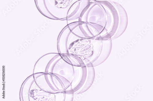 A sample of skin serum or moisturizing gel in a Petri dish. A cosmetic product. photo