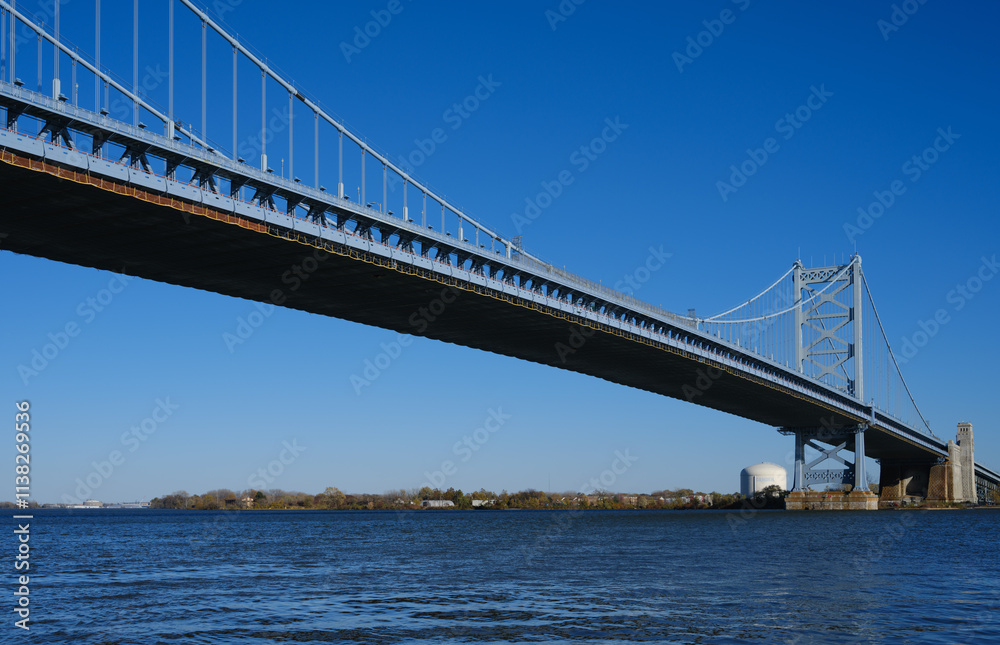 The Ben Franklin Bridge built in 1926 spanning between Philadelphia PA and Camden New Jersey on a beautiful blue sky afternoon The Ben Franklin Bridge built in 1926 spanning between Philadelphia PA and Camden New Jersey on a beautiful blue sky afternoon