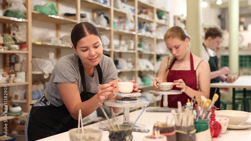 Young woman teacher sculpts ceramic product. High quality 4k footage
