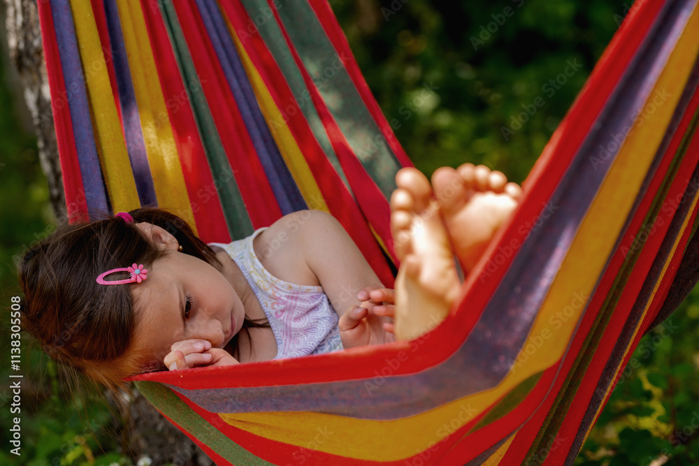 Sad young beautiful girl lying in a hammock Sad young beautiful girl lying in a hammock