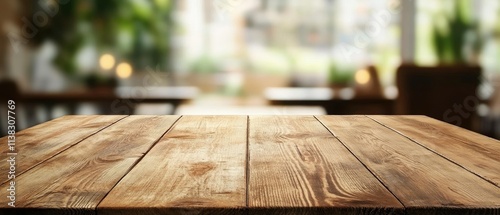 Empty wooden table in blurred cafe background.