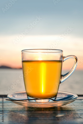 Wallpaper Mural Cup of green tea front of at sunset light on wooden tabletop. Torontodigital.ca