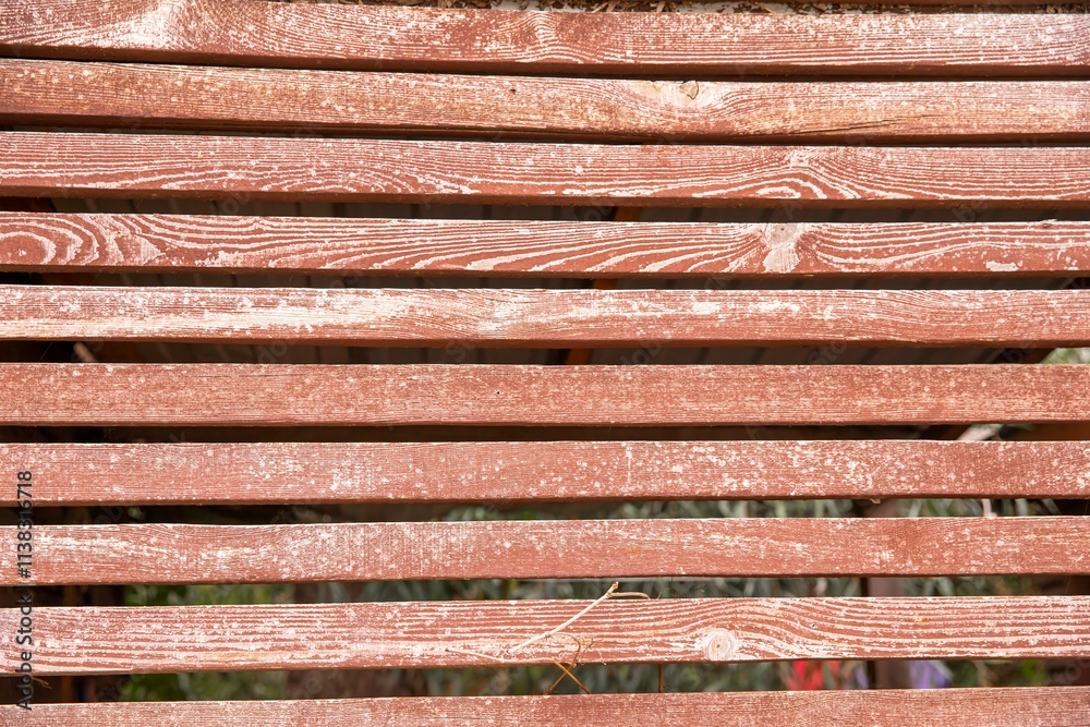 Weathered Wooden Fence with Natural Grain Texture and Rustic Red Paint Weathered Wooden Fence with Natural Grain Texture and Rustic Red Paint