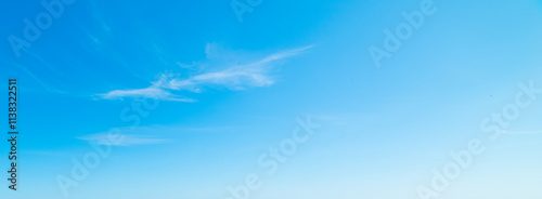 Small white clouds in the blue sky