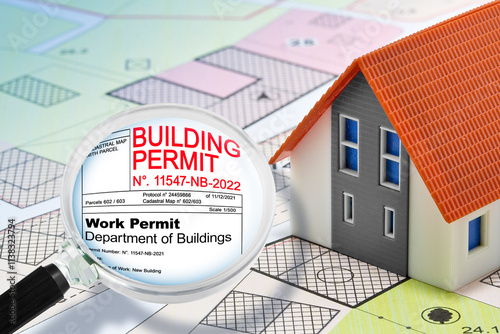 REAL ESTATE AND CONSTRUCTION INDUSTRY CONCEPT WITH BUILDING PERMIT, General Urban Plan, home model and magnifying glass
