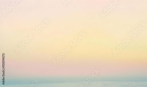 A serene gradient sky transitioning from soft pastels to light hues.